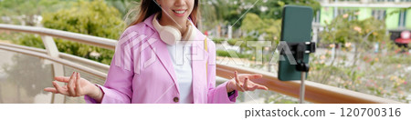 Creating Content Outdoors with Smartphone on Tripod 120700316