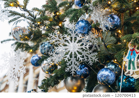 New Year's colorful trees in front of the Central Department Store in Moscow on Kuznetsky Most 120700413