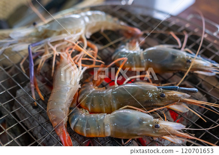 Raw shrimp on the grill 120701653