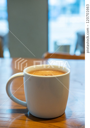 A cup of hot chocolate on the table in the cafe 120701663
