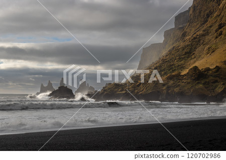 Mountain and rock formations in the ocean, Vik, Iceland 120702986