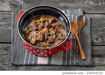 beer braised pork stew in a red pot beer braised pork stew in a red pot 120703510