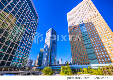 Tokyo cityscape in Japan: Overlooking the office district of Shiodome bathed in the morning sunlight. Azabudai in the background...Towards a new era = 9th Tokyo cityscape in Japan: Overlooking the office district of Shiodome bathed in the morning sunlight. Azabudai in the background...Towards a new era = 9th 120705639