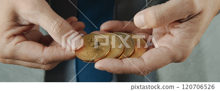 businessman with bitcoins, web banner format 120706526