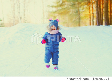Winter happy smiling child having fun on snow Winter happy smiling child having fun on snow 120707271