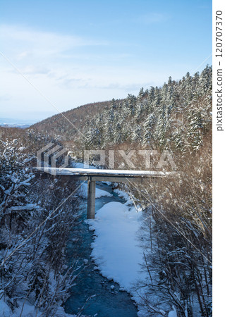 bridge over the river in winter 120707370