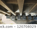 Modern structure seen from underneath the highway 120708029
