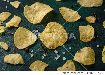 Crispy salty homemade potato chips Crispy salty homemade potato chips 120709735
