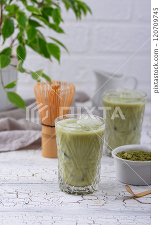 Cold matcha tea with milk and ice 120709745