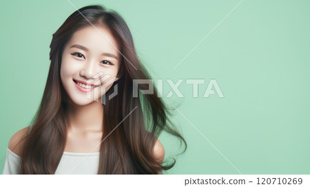Portrait of smiling asian teenager girl green background. 120710269