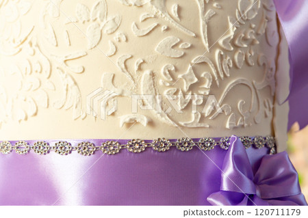wedding cake decoration. beautiful wedding cake with purple orchids. cake in violet tones wedding cake decoration. beautiful wedding cake with purple orchids. cake in violet tones 120711179