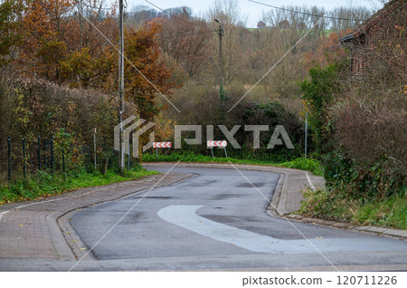 Bending street through the countryside in Oud-Heverlee, Belgium 120711226