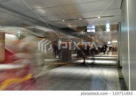 People walking through the underground passage 120711883