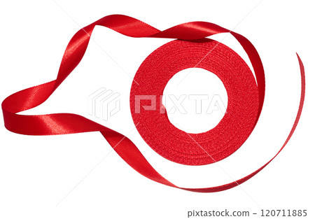 A spool with a red silk ribbon on a white isolated background 120711885