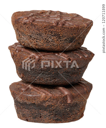 Stack of round baked brownie pieces on isolated background 120711899