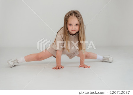 Cute girl 4-5 year old posing in studio Cute girl 4-5 year old posing in studio 120712087