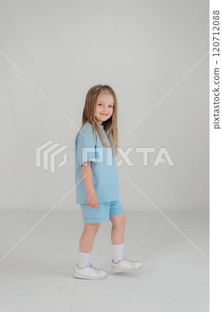 Cute girl 4-5 year old posing in studio 120712088