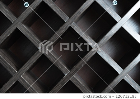 Wooden shelving unit showcasing an empty grid structure in a modern setting Wooden shelving unit showcasing an empty grid structure in a modern setting 120712185