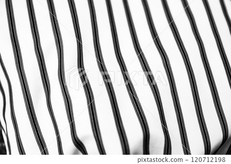 Black and white striped textile showcasing a modern design in fabric art Black and white striped textile showcasing a modern design in fabric art 120712198