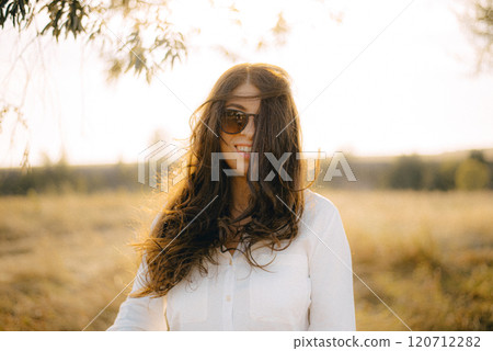 Brunette woman with long hair spending leisure time 120712282