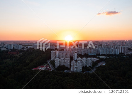 Breathtaking sunset over the city skyline revealing urban architecture and nature embraced at twilight Breathtaking sunset over the city skyline revealing urban architecture and nature embraced at twilight 120712301
