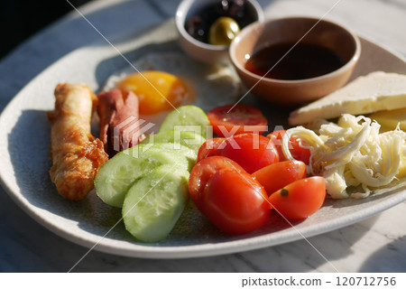A Nutritious and Healthy Breakfast Platter Featuring Fresh Vegetables and a Dipping Sauce 120712756