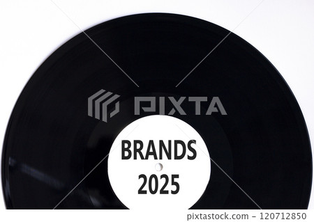 Planning brands 2025 new year symbol. Concept words Brands 2025 on beautiful white and black vinyl disk. Beautiful white background. Business brands 2025 new year concept. Copy space. 120712850
