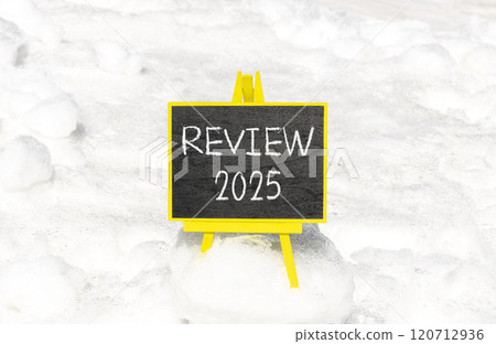 Planning review 2025 new year symbol. Concept words Review 2025 on beautiful yellow chalk blackboard. Beautiful white snow background. Business review 2025 new year concept. Copy space. 120712936