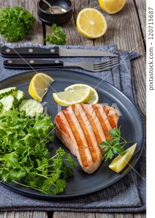 grilled tuna steak on a plate, top view grilled tuna steak on a plate, top view 120715687