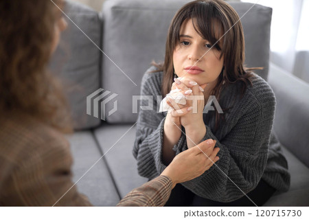 Sad woman crying at psychologist session female specialist help aid mental assistance closeup Sad woman crying at psychologist session female specialist help aid mental assistance closeup 120715730