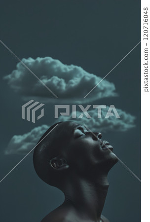 Conceptual depiction of a believing person, head turned towards heaven, radiating inner peace, calm equilibrium and hope 120716048