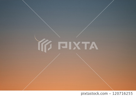 The thin moon just before the new moon and earthlight shining in the dawn sky 120716255