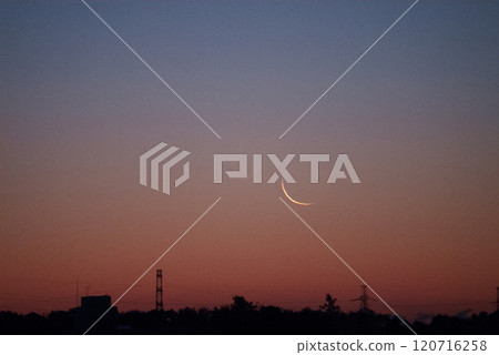 The thin moon just before the new moon and earthlight shining in the dawn sky 120716258