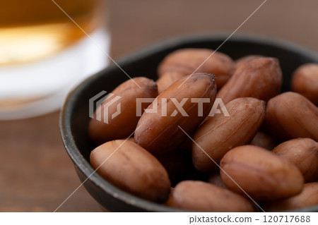 Close-up of boiled peanuts in a small bowl as a snack to go with alcohol 120717688