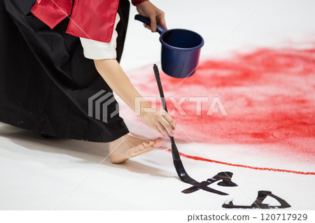 A woman writing on a piece of paper A woman writing on a piece of paper 120717929