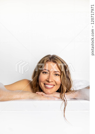 Woman Lying In Bathtub With Foam While Relaxing In Luxury Bathroom At Home, Happy Young Female Woman Lying In Bathtub With Foam While Relaxing In Luxury Bathroom At Home, Happy Young Female 120717971