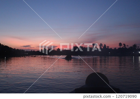 Sunrise seen from a boat in the Mekong Delta Sunrise seen from a boat in the Mekong Delta 120719090