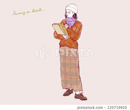 A stylish woman holding a file and taking notes 120719920