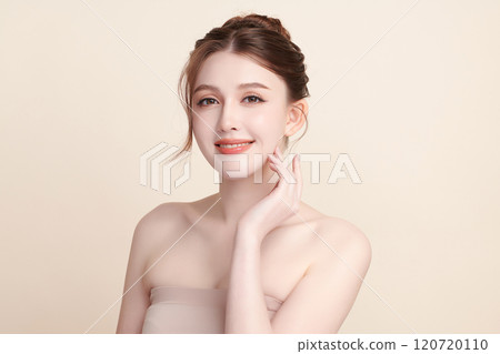 Beautiful young asian woman with clean fresh skin on beige background, Face care, Facial treatment, Cosmetology, beauty and spa, Asian women portrait. 120720110