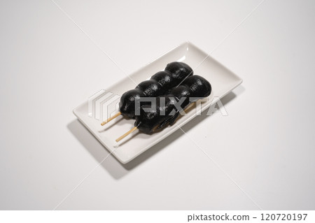 Black sesame paste rice dumplings on a plate Black sesame paste rice dumplings on a plate 120720197