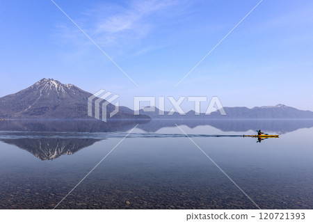 Canoeing on the reflective surface of Lake Shikotsu and Mount Eniwa, Chitose, Hokkaido [April] 120721393