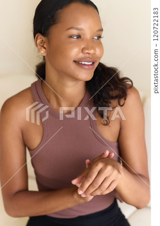 Woman Smiling While Applying Anti-Aging Skincare to Hands Woman Smiling While Applying Anti-Aging Skincare to Hands 120722183