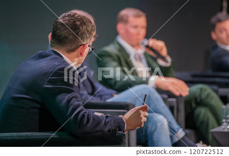 Industry experts discuss strategies in a business conference setting Industry experts discuss strategies in a business conference setting 120722512