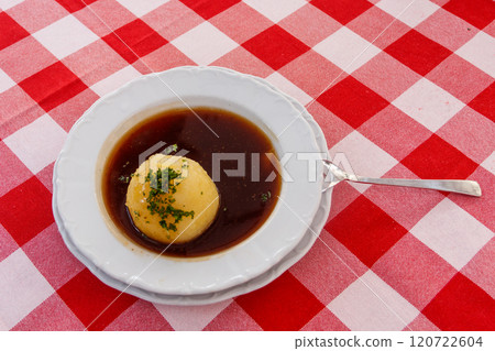 German potato dumpling in sauce on a table 120722604
