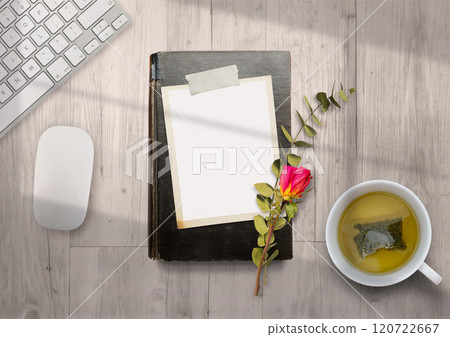 Mockup notebook and tea on desk, relaxing space with natural light Mockup notebook and tea on desk, relaxing space with natural light 120722667