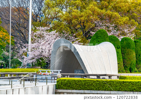 Hiroshima Peace Memorial Park: Memorial monument and cherry blossoms Hiroshima Peace Memorial Park: Memorial monument and cherry blossoms 120722838