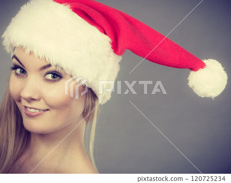 Happy woman wearing Santa Claus helper hat Happy woman wearing Santa Claus helper hat 120725234