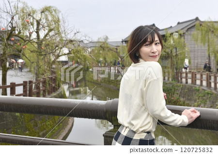 A young woman posing in the streets of Sawara A young woman posing in the streets of Sawara 120725832