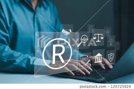 Registered trademark, intellectual property concept. Businessman working on laptop with digital icons register trademarks, copyright, patent, intellectual property law, legal protection in business. Registered trademark, intellectual property concept. Businessman working on laptop with digital icons register trademarks, copyright, patent, intellectual property law, legal protection in business. 120725929