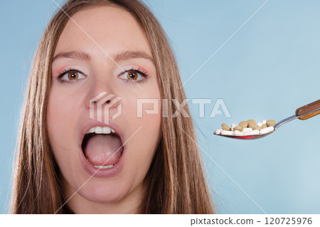 Woman patient taking pills tablets. Drug addict. 120725976